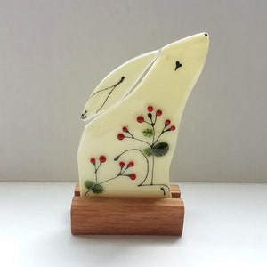 Winter moongazing hare, fused glass hare with winter berries, folkart hare in glass with stand.