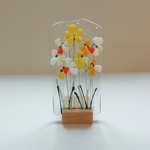 Layered daffodil fused glass, glass daffodils in wooden stand, shelf ornament yellow spring flowers.