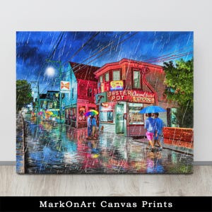 May include: Canvas print of a rainy street scene with colorful buildings and people with umbrellas. The Lobster Pot restaurant is visible, with neon signs. The artwork is signed "MarkOnArt Canvas Prints".