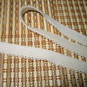 10 yards 3/8&quot; width in ivory color one side scroll elastic trim for your fashion design/headband/swim wear design decor. and sewing project.