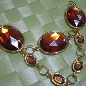 1 piece in 8&quot; length x 1 3/8&quot; width with gold ton chain style acrylic bead fringe applique for your sewing project.