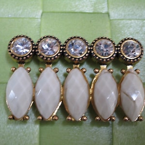 1 piece in 1 1/2&quot;x1&quot; width gold tone with cream color and clear color acrylic bead buckle applique/ to sew on for your sewing project.