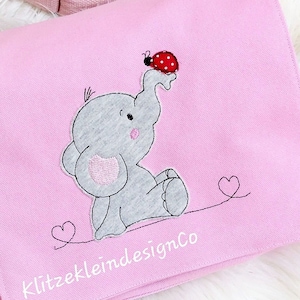 May include: Pink fabric bag with a gray elephant and a red ladybug embroidered on it. The bag has a pink strap and the text "KlitzekleindesignCo" is printed on the bottom.