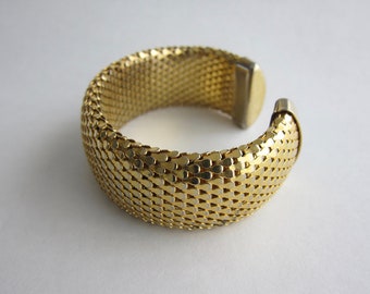 1980, large open chain mail bangle with scale patterns. Rare.