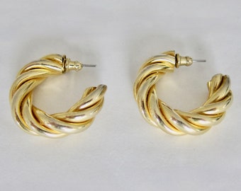 1960, XL twisted gold metal hoop earrings. Unsigned.
