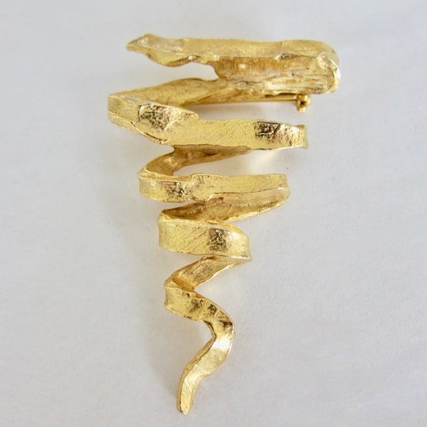 Edouard Rambaud Paris 1980, large textured gold metal spiral brooch. Unsigned but listed.
