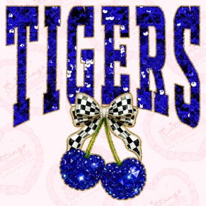 May include: A graphic design featuring the word "TIGERS" in blue sequins with gold trim. Below the word is a bow with a black and white checkered pattern and two blue jewel-toned cherries. The background is light pink.