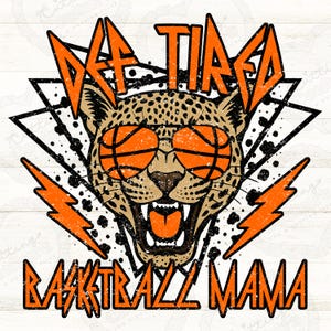 May include: A graphic design featuring a cheetah wearing basketball-shaped sunglasses and the words "Def Tired Basketball Mama" in orange, with lightning bolt accents. The cheetah has a spotted coat and an open mouth.