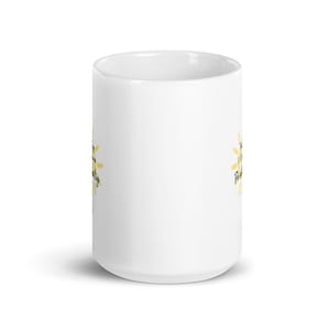 May include: White ceramic mug with a yellow sun graphic and the text "The sun is always shining" on one side and "Positively" on the other side.