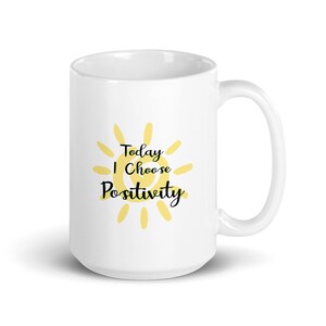 May include: White ceramic mug with a yellow sun graphic and the text "Today I Choose Positivity".
