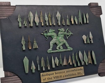 A mini collection of antique bronze arrowheads of the VIII-II centuries BC. Museum copy, reproduction, replica.