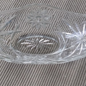 vintage Anchor Hocking condola shaped clear glass bowl.  Decorative with carved stars, scalloped edge.