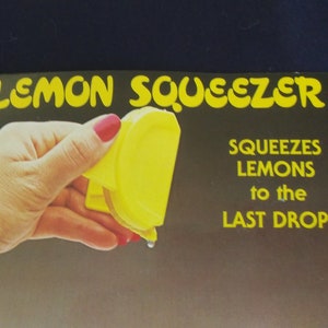 vintage lemon squeezer, yellow plastic, made in Hong Kong.