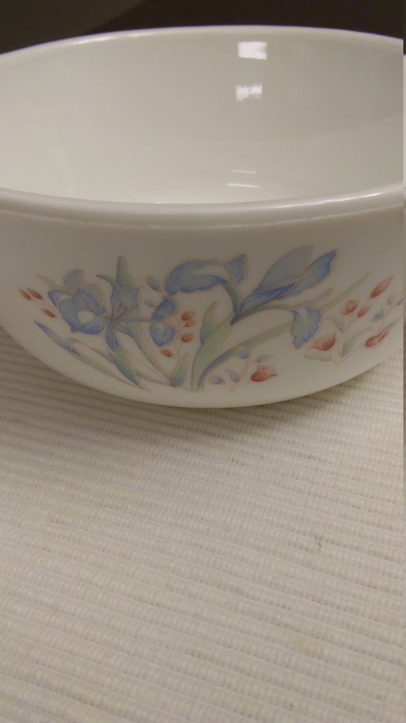 Pyrex small baking dish with blue and maroon flowers made in England.