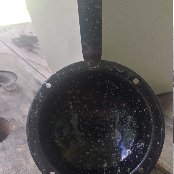 Enamel ware/granite ware egg poacher cup.  Vintage, dark blue with gray spots. I believe it was made in the 50's.