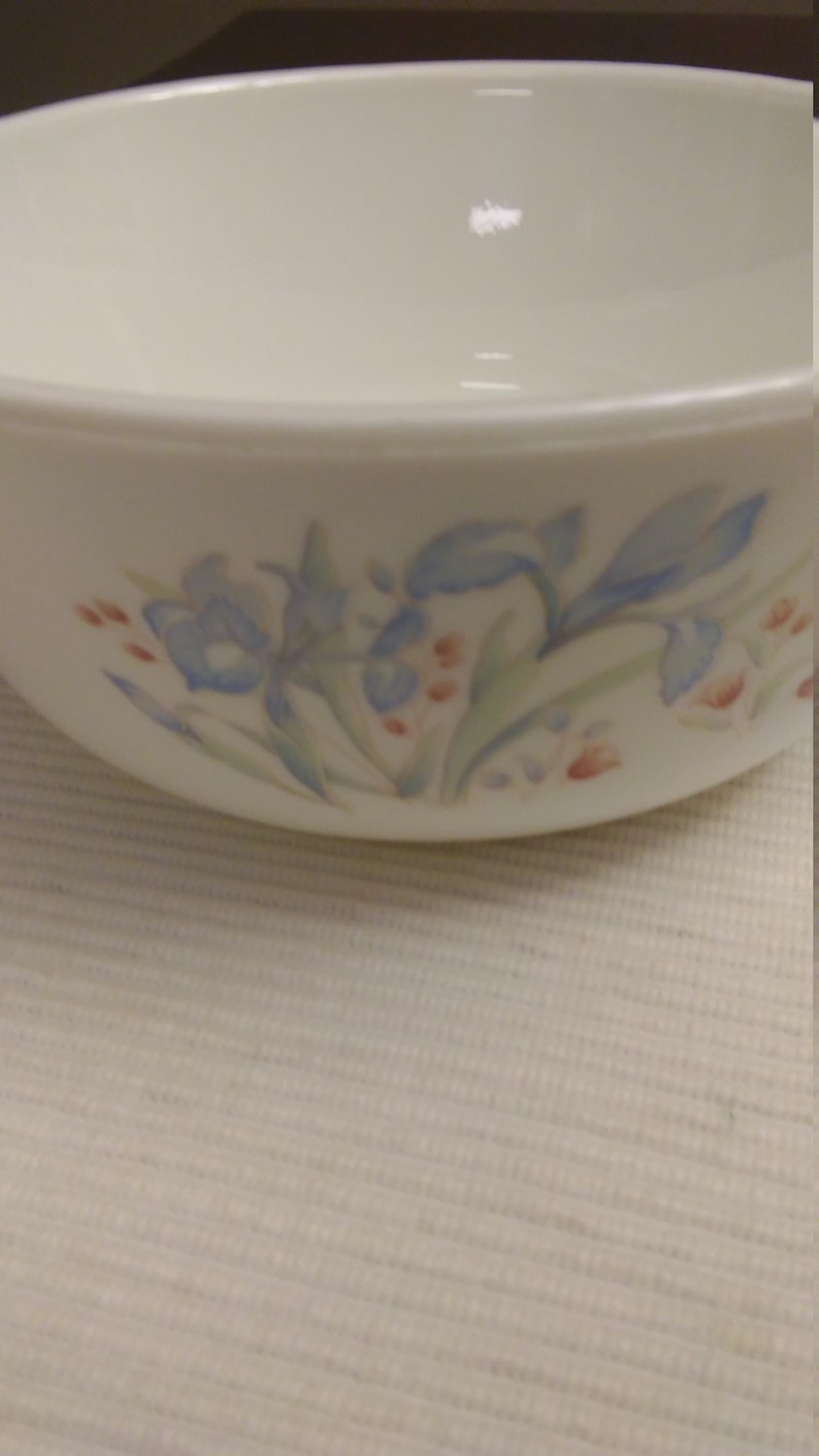 Pyrex small baking dish with blue and maroon flowers made in England.