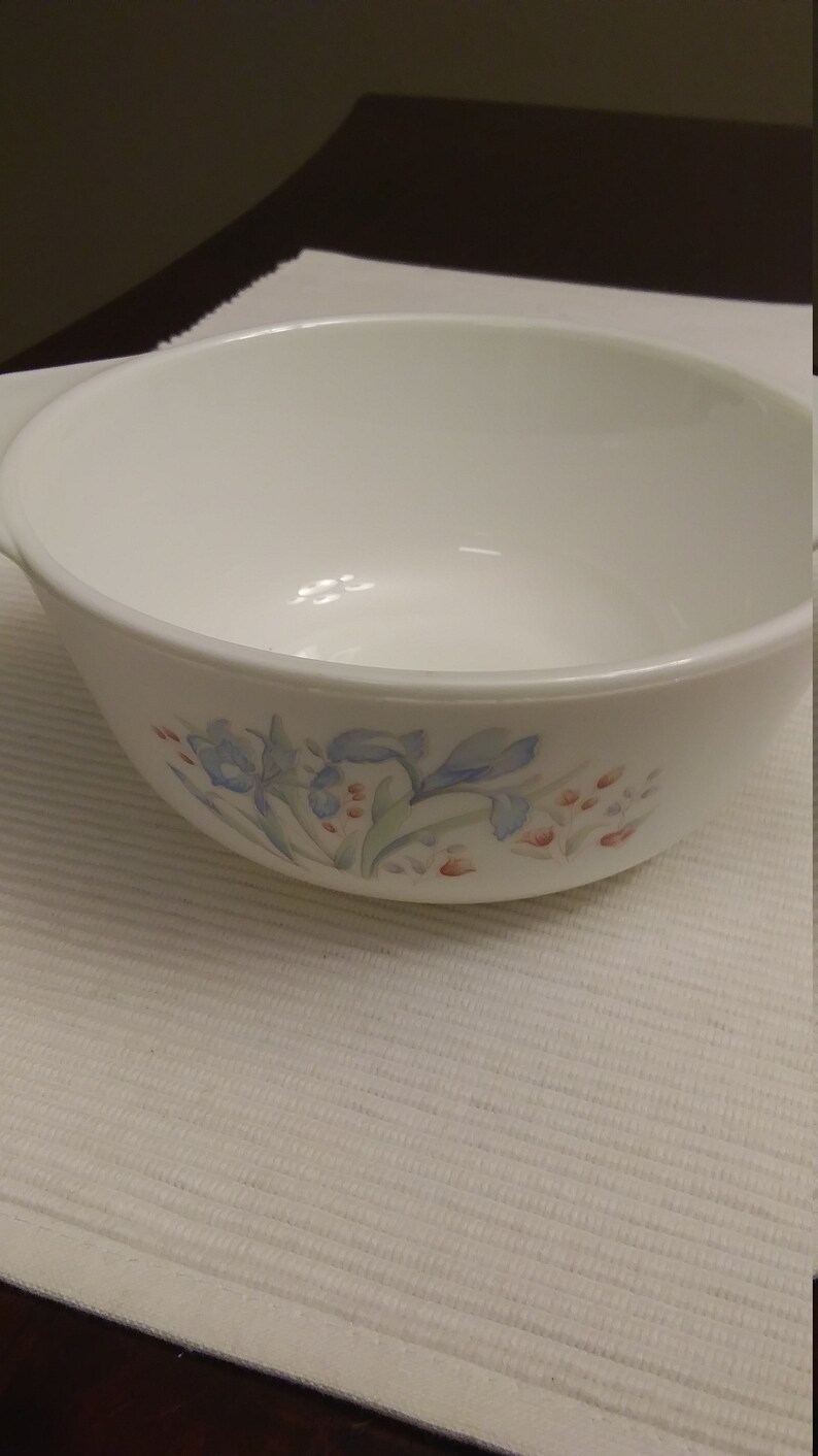 Pyrex small baking dish with blue and maroon flowers made in England.