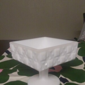 Milk glass dish with a pedestal by Westmoreland.  Quilt pattern.  Vintage.