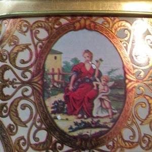 vintage small octagonal tin, Victorian motif.  Made in Brazil by Meister.