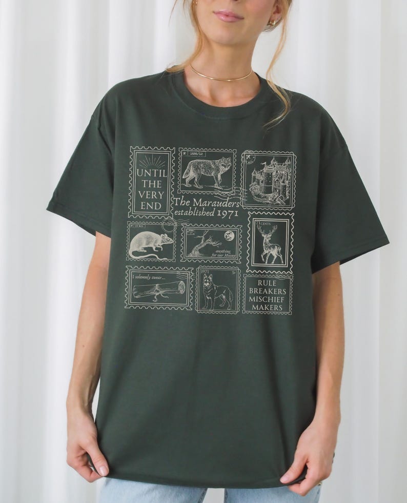 May include: A dark green t-shirt with a white graphic print of a series of stamps featuring various animals and the text "The Marauders established 1971" and "Until the very end".