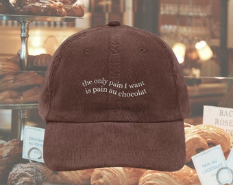 The only pain I want is pain au chocolat embroidered corduroy cap dad hat * Pinterest trendy coquette aesthetic cozy foodie wavy letters