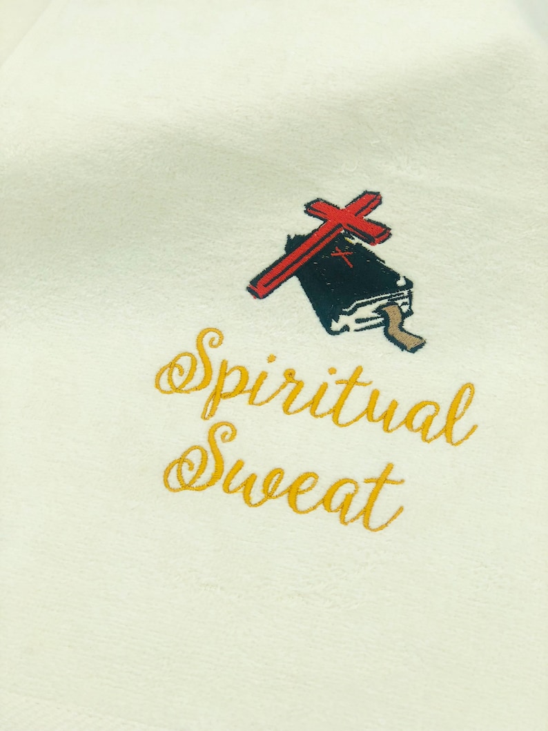May include: White sweatshirt with gold embroidery that reads "Spiritual Sweat" and a black and red illustration of a book with a cross on top.