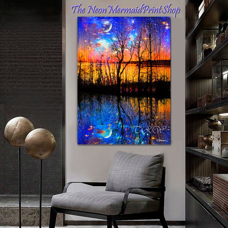 May include: A digital painting of a forest reflected in a lake. The sky above the forest is a vibrant orange and pink with a crescent moon and stars. The reflection in the lake is a deep blue with a crescent moon and stars. The text "The Neon Mermaid Print Shop" is at the top of the image.