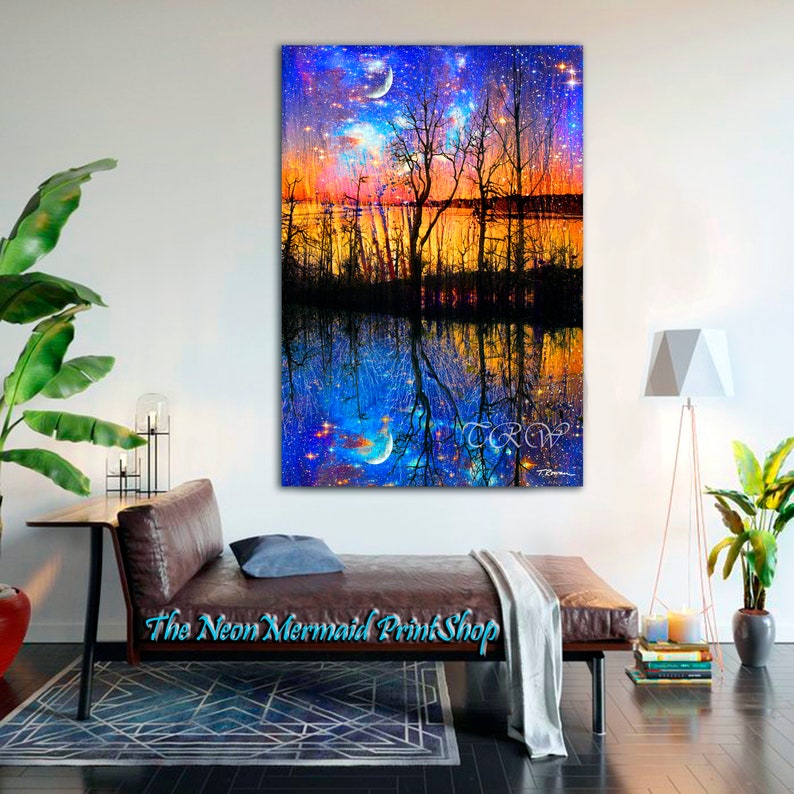 May include: A digital painting of a starry night sky reflected in a lake. The sky is a vibrant blue with white stars and a crescent moon. The lake is a dark blue with reflections of the trees and sky. The trees are silhouetted against the sky and lake. The painting is signed "TRC" in the bottom right corner.