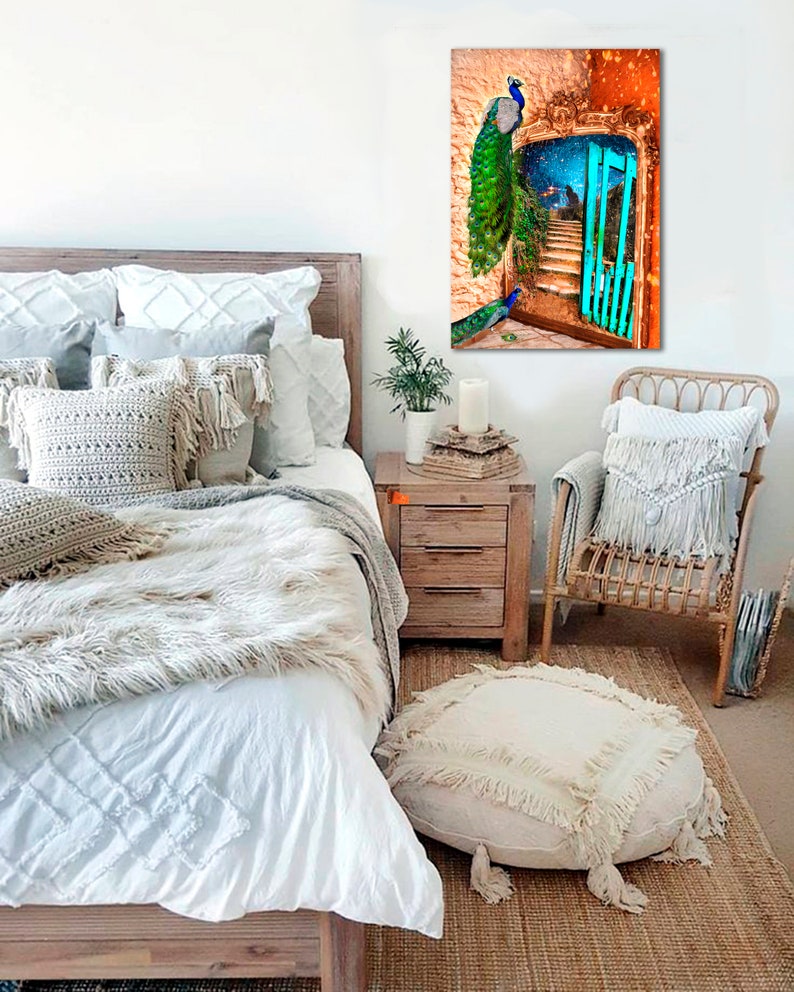 May include: A bedroom scene with a canvas print depicting peacocks and a turquoise gate. The room includes a wooden bed frame, white bedding, decorative pillows, a woven chair, and a round ottoman with fringe. The artwork is the focal point.
