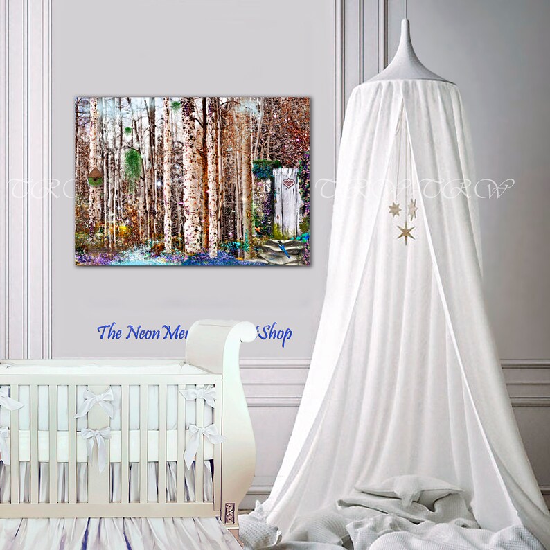 May include: A white canopy bed with a white crib and a white canopy with gold stars hanging from it. A colorful painting of a forest scene hangs on the wall behind the crib.