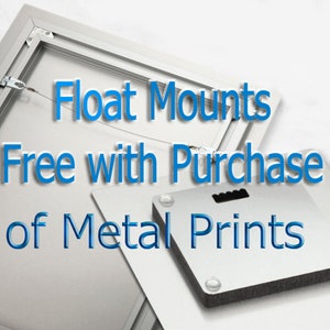 May include: A metal print with a float mount, showing the back of the print. The text "Float Mounts Free with Purchase of Metal Prints" is in blue. The metal print has a silver finish.
