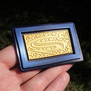JL, B v S, D o J, Super-Mammal Belt Buckle Emblem