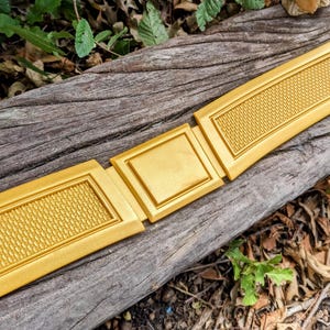 Super-Mammal Birthright Belt & Cape Emblem