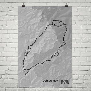 May include: A black and white topographic map of the Tour du Mont Blanc trail, with a black outline of the trail. The text "Tour du Mont Blanc 110 mi" is at the bottom of the map.