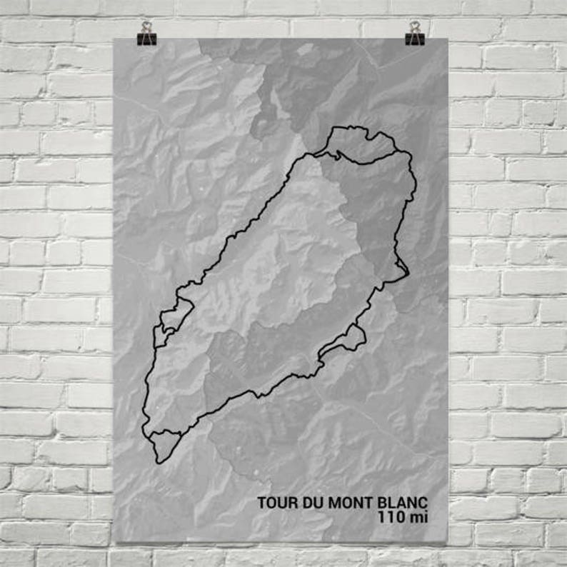 May include: A black and white topographic map of the Tour du Mont Blanc trail, with a black outline of the trail. The text "Tour du Mont Blanc 110 mi" is at the bottom of the map.