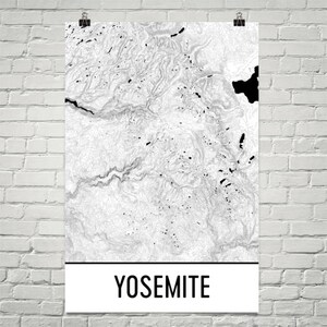 May include: Black and white topographic map print of Yosemite National Park with the word "Yosemite" in black text at the bottom.