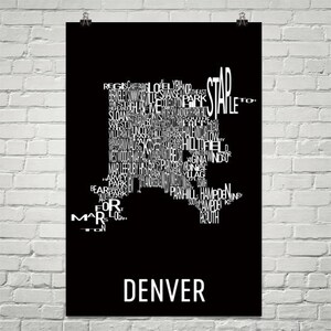 May include: Black poster featuring a white map of Denver, Colorado, composed of neighborhood names. The word "DENVER" is printed in white at the bottom. The poster is hanging on a white brick wall.