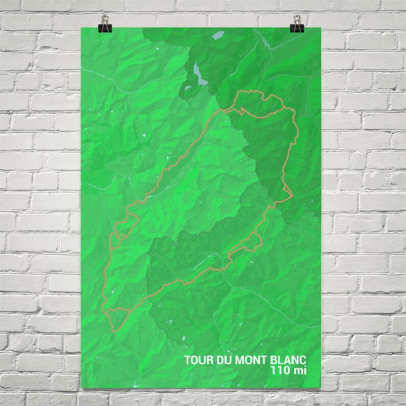 May include: A green topographic map of the Tour du Mont Blanc cycling route, with a brown line tracing the path. The text "Tour du Mont Blanc 110 mi" is at the bottom of the map.