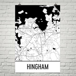 May include: Black and white map of Hingham, Massachusetts. The map shows the roads, streets, and bodies of water in the town. The town name is printed in white at the bottom of the map.