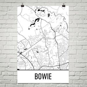 May include: A black and white map print of Bowie, Maryland, USA. The print features a detailed street map with roads, parks, and waterways. The city name "BOWIE" is printed in bold, black letters at the bottom of the print.