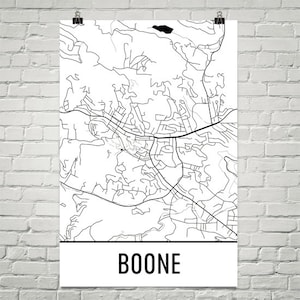 May include: A black and white map of Boone, North Carolina, with roads and geographical features. The town's name is printed in bold, black capital letters at the bottom of the poster. The map is displayed on a white background.