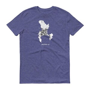 May include: A blue t-shirt with a white outline of Cape Town, South Africa. The text "CAPE TOWN * ZA" is printed below the outline.