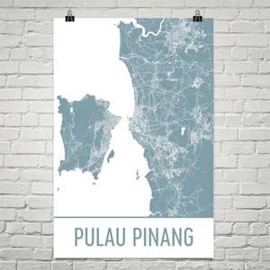 May include: A poster showing a detailed map of Pulau Pinang, Malaysia, in blue and white. The map highlights the island's geography and urban areas. The text "PULAU PINANG" is displayed in a bold, sans-serif font at the bottom of the poster.