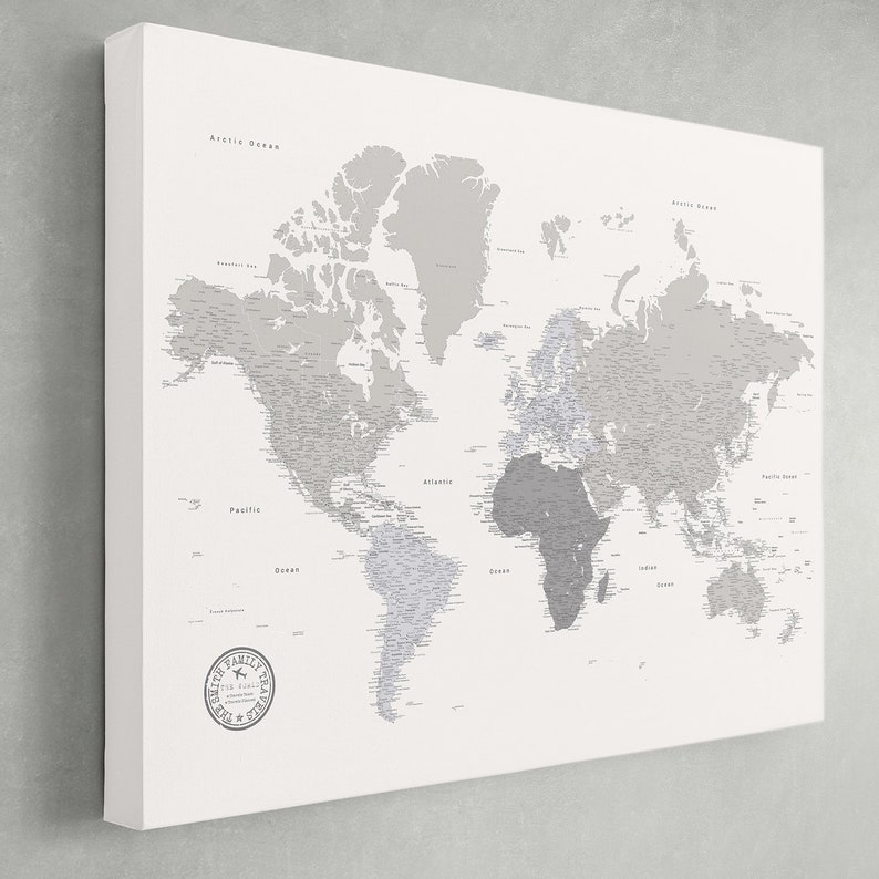 May include: A world map printed on a white canvas. The map features a gray color scheme with country names and labels. The canvas has a stamp in the lower left corner that reads "Smith Family Places".