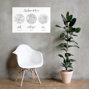May include: A white rectangular wall print featuring the names Stephanie & Kevin at the top. Below are three circular black and white street maps, each marked with a small red heart. Underneath each map are the phrases Hello, Will You, and I Do.