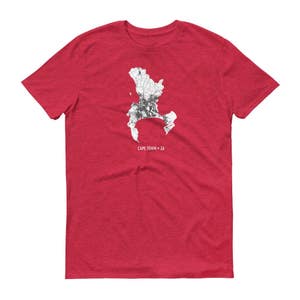 May include: Red t-shirt with a white outline of Cape Town, South Africa, and the text "CAPE TOWN - ZA".