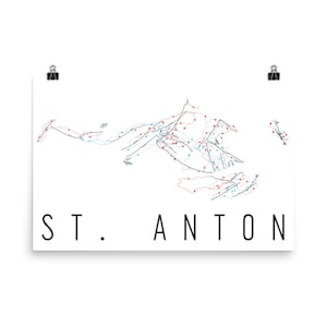 May include: A black and white line art map of the ski resort St. Anton, Austria. The map shows the different ski runs and lifts. The text "ST. ANTON" is printed below the map.