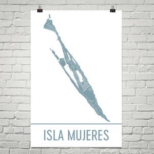 May include: A poster featuring a detailed map of Isla Mujeres in a muted blue-gray color. The island's outline is filled with intricate street details, set against a white background. The words "ISLA MUJERES" are printed in a matching blue-gray font.