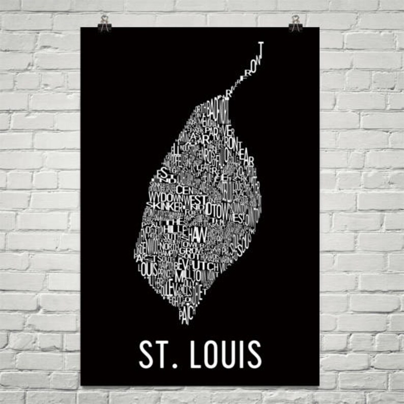 May include: A black and white typography art print of the city of St. Louis, Missouri. The print features the names of different neighborhoods in the city, arranged in the shape of the city's outline.