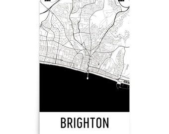 May include: Black and white map print of Brighton, England. The map shows the city's streets and coastline. The word "Brighton" is printed in white at the bottom of the map.